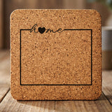 Wyoming square cork coaster engraved with the state outline and home in script with a heart