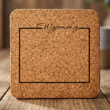 Wyoming square cork coaster engraved with the state outline and Wyoming in script lettering