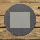 Wyoming round slate coaster with the full state shape engraved