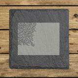 Wyoming square slate coaster engraved with the state shape in ornate floral scrollwork