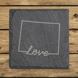 Wyoming square slate coaster engraved with a hand-drawn state outline and love in cursive