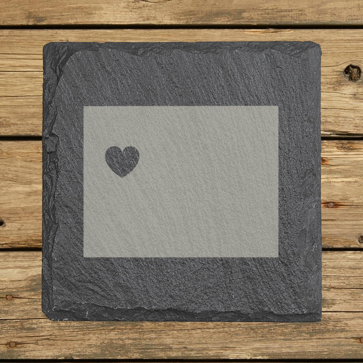 Wyoming square slate coaster engraved with the state shape and a heart