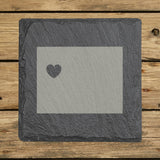 Wyoming square slate coaster engraved with the state shape and a heart