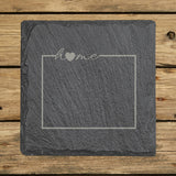 Wyoming square slate coaster engraved with the state outline and home in script with a heart