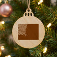 Wyoming round wood Christmas ornament engraved with the state shape in ornate floral scrollwork